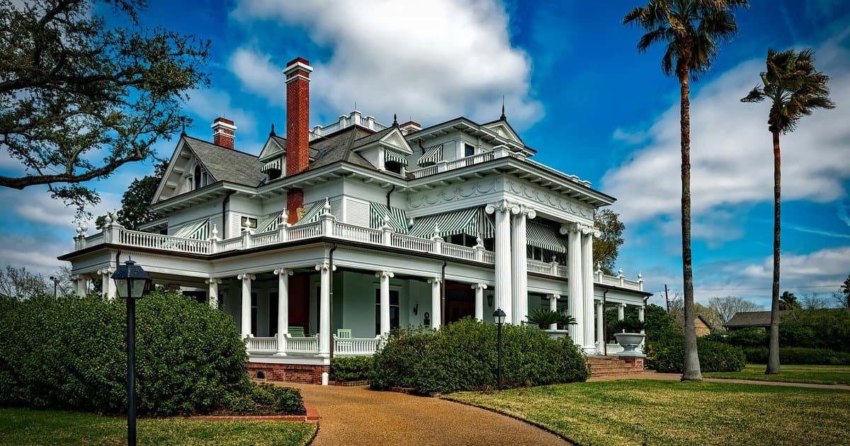 Historic Southern mansion with columns and manicured grounds