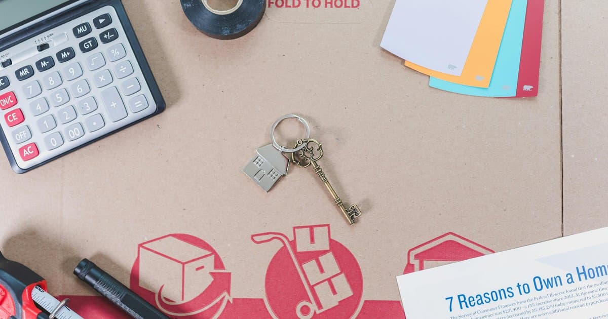 Home buying planning materials with keys and documents