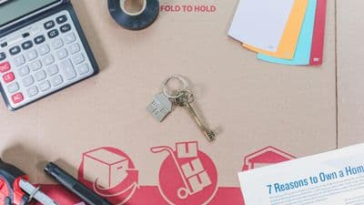 Home buying planning materials with keys and documents